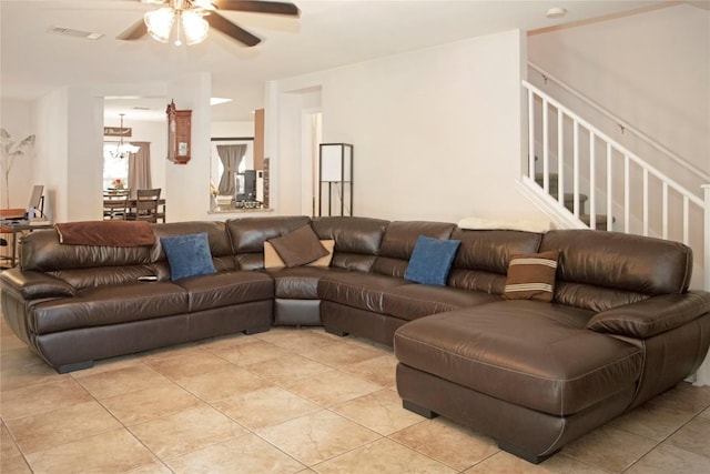 living room featuring ceiling fan and light tile patterned floors