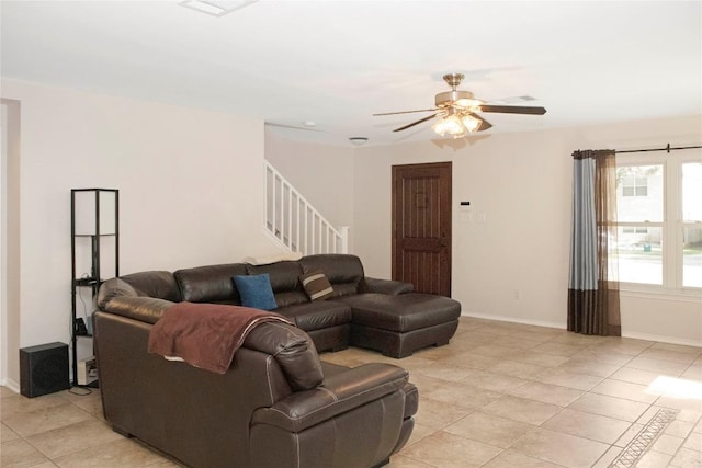 living room with light tile patterned floors and ceiling fan