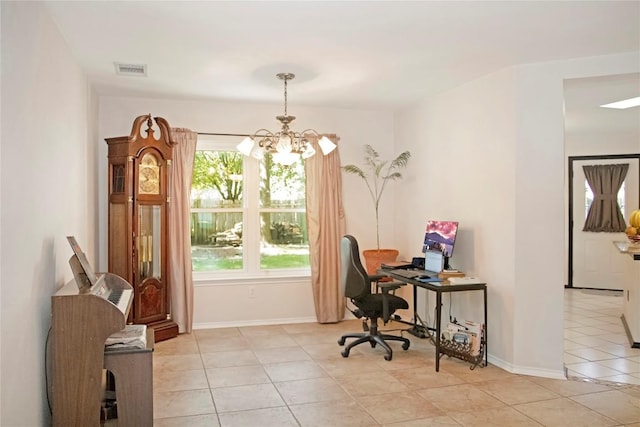 tiled office space featuring a healthy amount of sunlight and an inviting chandelier