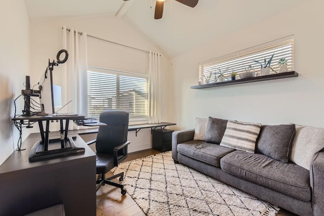 office space featuring hardwood / wood-style flooring, high vaulted ceiling, ceiling fan, and beam ceiling