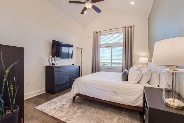 bedroom featuring lofted ceiling, dark wood-type flooring, and ceiling fan