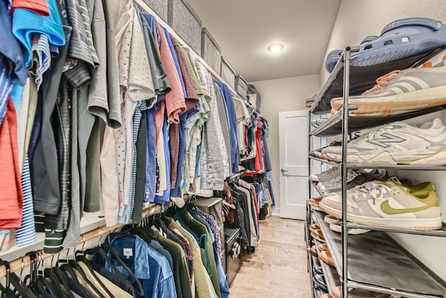 spacious closet with light wood-type flooring