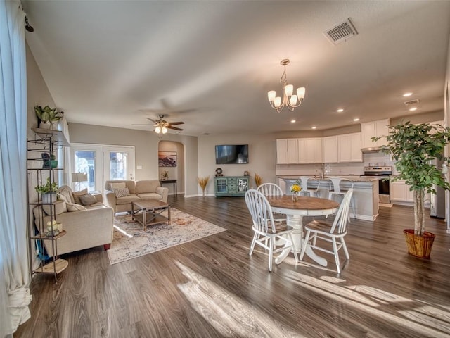 dining area with dark wood-style flooring, baseboards, visible vents, and recessed lighting