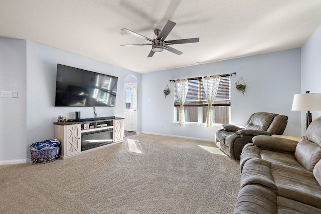 living room with carpet and ceiling fan