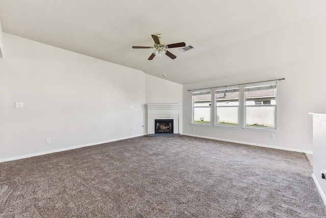 unfurnished living room featuring carpet flooring, ceiling fan, and a brick fireplace