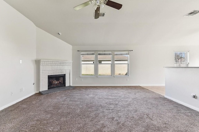 unfurnished living room with carpet flooring, ceiling fan, a fireplace, and lofted ceiling