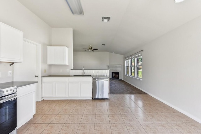 kitchen featuring ceiling fan, sink, white cabinets, and stainless steel appliances