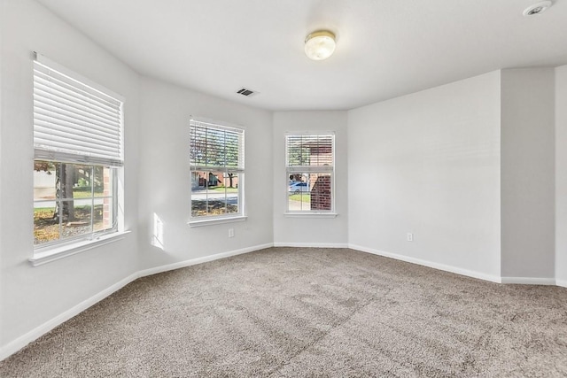 spare room featuring carpet floors