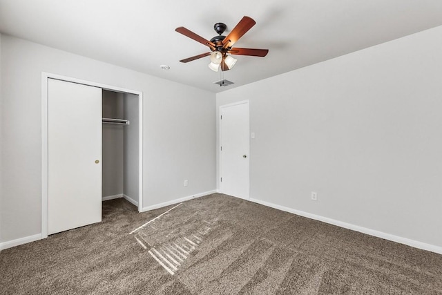 unfurnished bedroom with carpet flooring, ceiling fan, and a closet