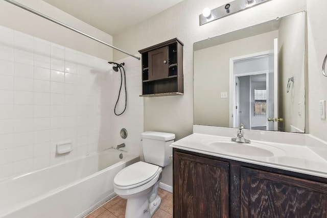 full bathroom with tile patterned flooring, tiled shower / bath combo, toilet, and vanity