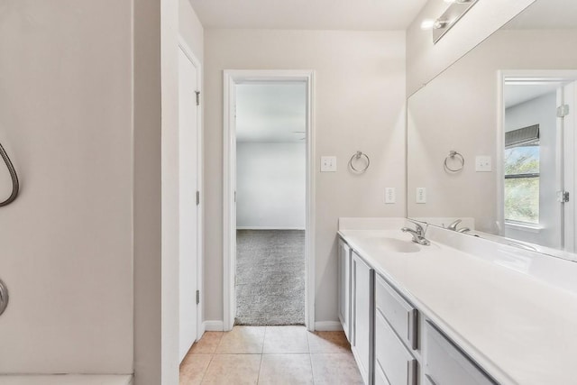 bathroom featuring tile patterned flooring and vanity