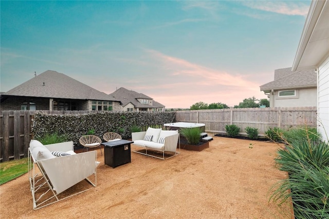 yard at dusk with an outdoor fire pit