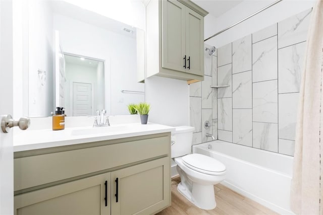 full bathroom featuring vanity, toilet, wood-type flooring, and shower / tub combo with curtain