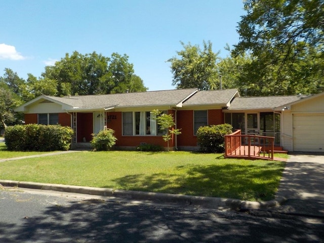 ranch-style house with a front lawn and a garage