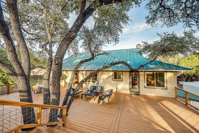 wooden terrace with outdoor lounge area