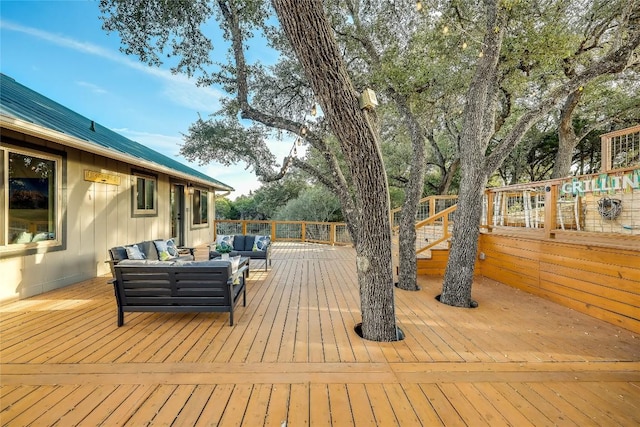 wooden deck featuring an outdoor hangout area