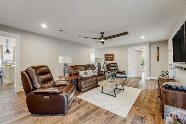 living room featuring ceiling fan