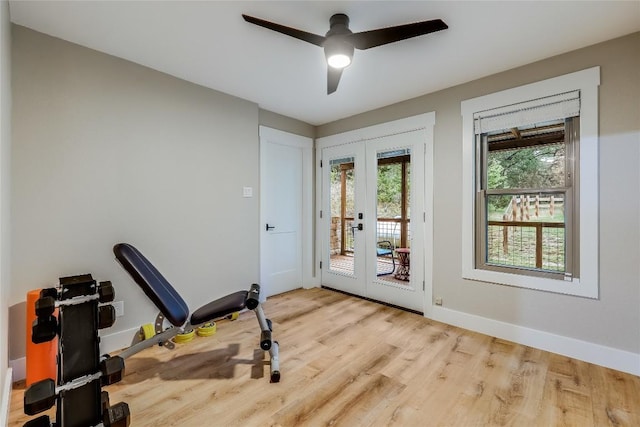 exercise room with french doors, light hardwood / wood-style flooring, and ceiling fan