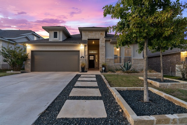 view of front of property featuring a garage