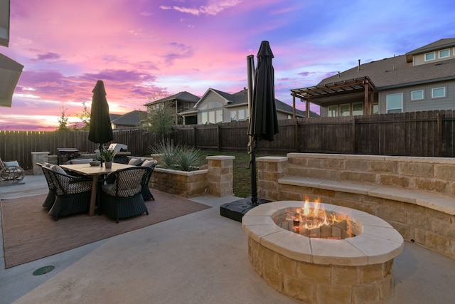 patio terrace at dusk with a fire pit