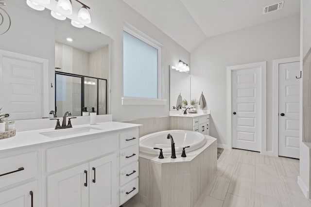 bathroom featuring lofted ceiling, vanity, and shower with separate bathtub