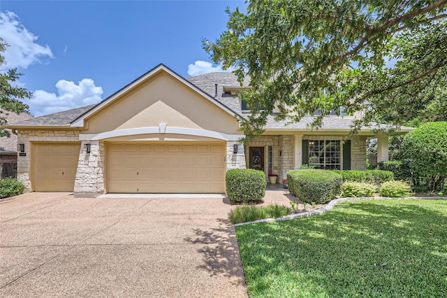 view of front of home with a garage and a front yard