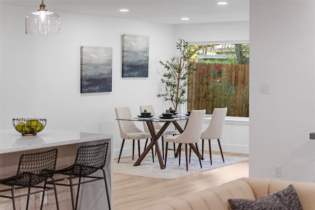 dining space with light wood-type flooring