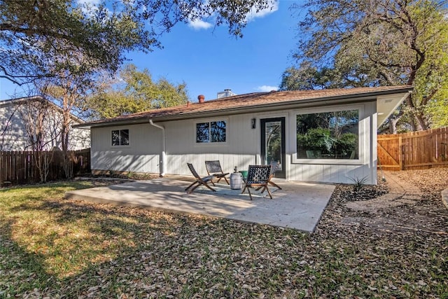 back of house with a patio area