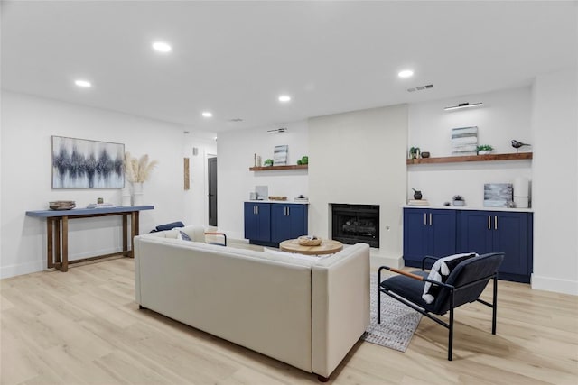 living room with light hardwood / wood-style floors