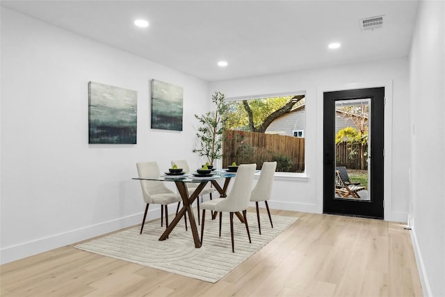 dining area with light hardwood / wood-style floors