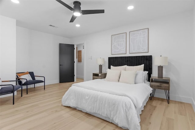 bedroom with ceiling fan and light wood-type flooring