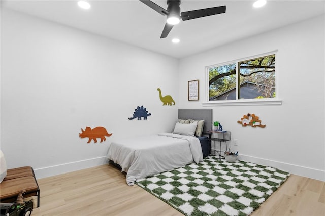 bedroom with hardwood / wood-style flooring and ceiling fan