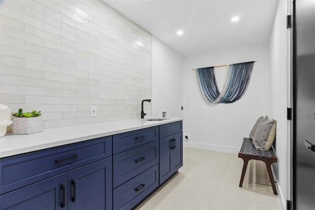 bathroom featuring decorative backsplash and vanity