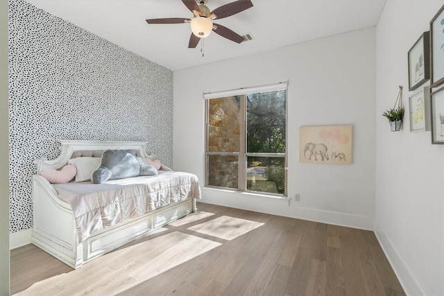 11600 Shoreview Overlook, Austin, TX 78732 - bedroom with wood finished floors, baseboards, and a ceiling fan