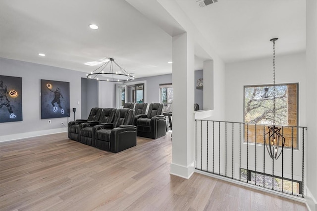 living room featuring light hardwood / wood-style flooring and a chandelier