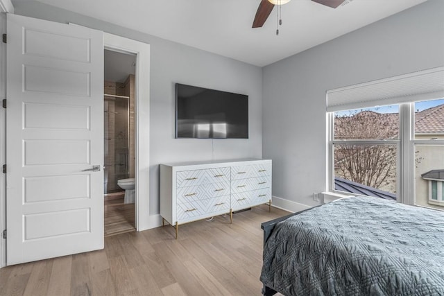 bedroom with light hardwood / wood-style floors, ensuite bath, and ceiling fan