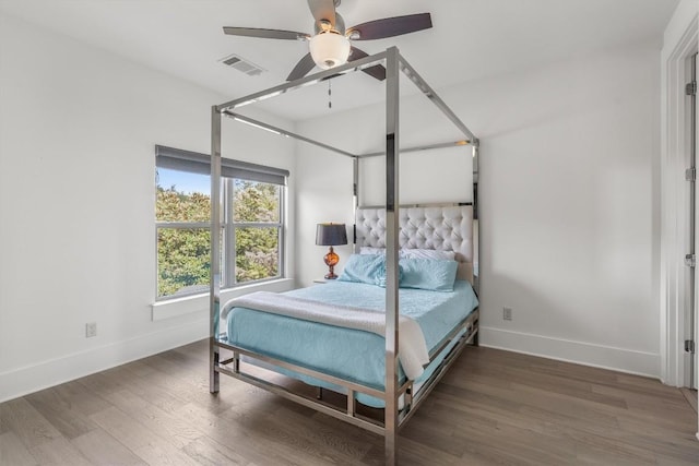 bedroom featuring dark hardwood / wood-style floors and ceiling fan