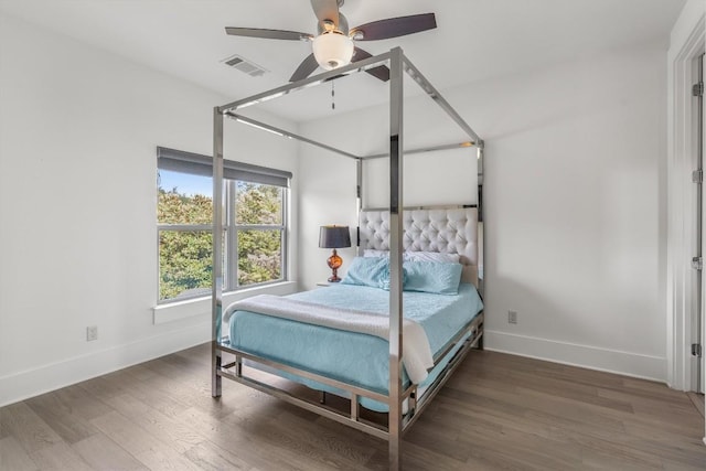 11600 Shoreview Overlook, Austin, TX 78732 - bedroom with baseboards, wood finished floors, and ceiling fan