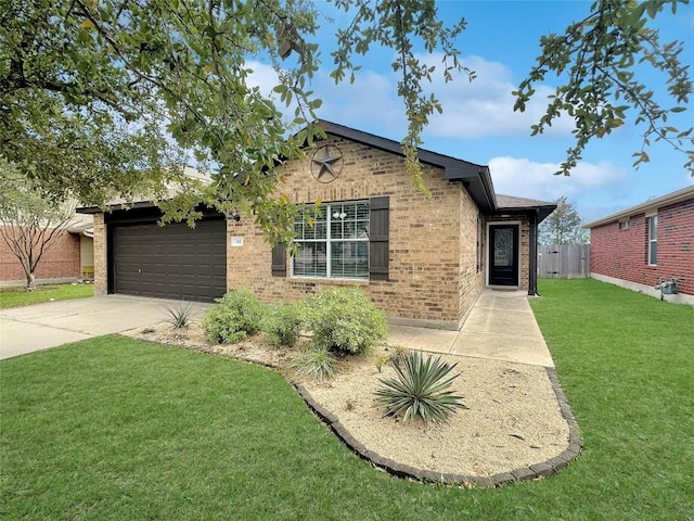 view of front of property with a garage and a front lawn