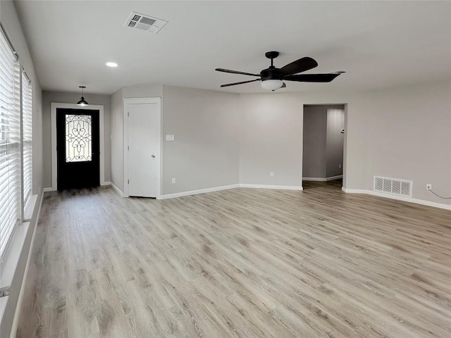 interior space with ceiling fan and light hardwood / wood-style flooring