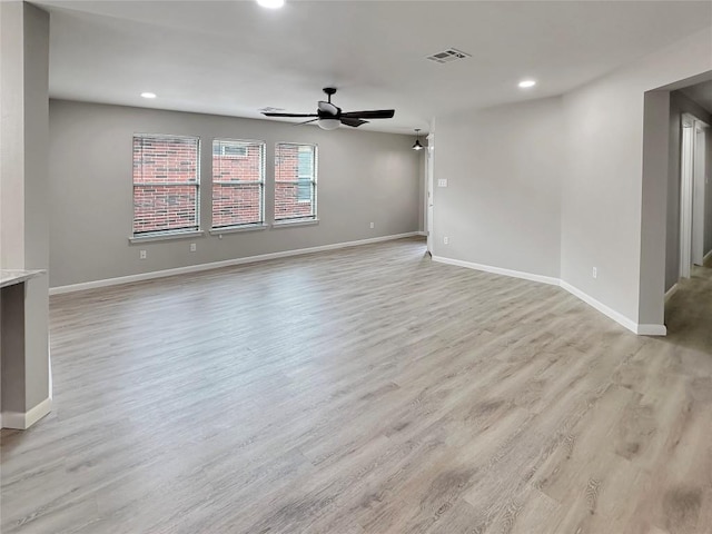 unfurnished room with light hardwood / wood-style floors and ceiling fan