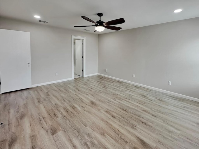 spare room featuring ceiling fan and light wood-type flooring