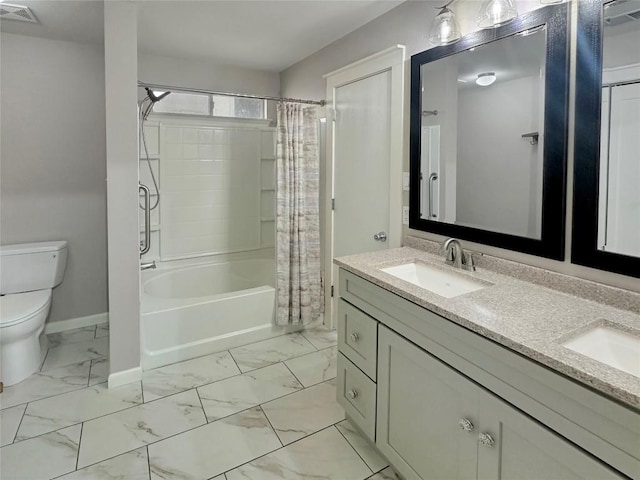 full bathroom featuring vanity, shower / bath combo, and toilet