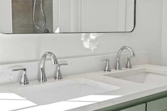 details featuring decorative backsplash, vanity, and walk in shower