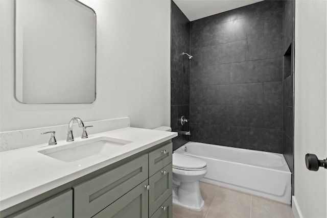 full bathroom featuring tile patterned floors, toilet, vanity, and tiled shower / bath