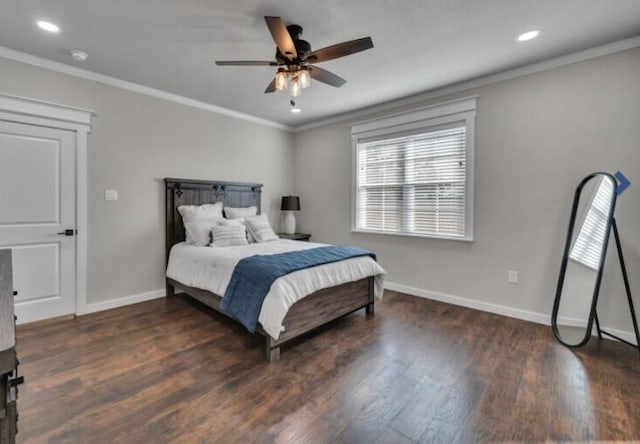 bedroom featuring dark hardwood / wood-style flooring, ceiling fan, and ornamental molding