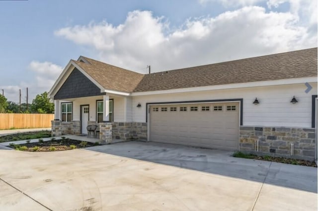 view of front facade with covered porch and a garage