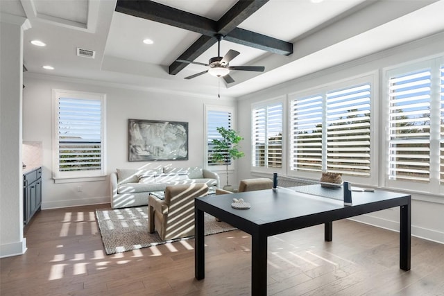 living room with coffered ceiling, ceiling fan, crown molding, wood-type flooring, and beamed ceiling