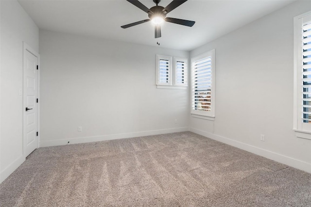 carpeted empty room with ceiling fan