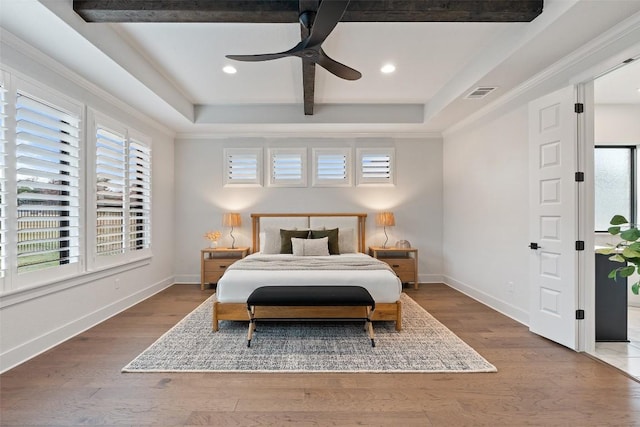 bedroom featuring ceiling fan, wood-type flooring, and ornamental molding